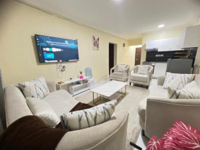 Fully furnished 2 bedroom Apartment with a Spacious balcony behind GATEWAY mall 10 Minutes to JKIA,5min to SGR with AC,washing Machine and Lift